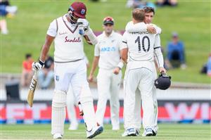 HAMILTON, NEW ZEALAND - DECEMBER 06: Shannon Gabriel of the West Indies looks dejected after being dismissed by Neil Wagner of New Zealand, who is congratulated by Will Young of New Zealand (L-R) on taking the final wicket during day four of the First Test match in the series between New Zealand and the West Indies at Seddon Park on December 06, 2020 in Hamilton, New Zealand. (Photo by Kai Schwoerer/Getty Images)
