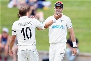 HAMILTON, NEW ZEALAND - DECEMBER 06: Neil Wagner of New Zealand is congratulated by Tim Southee of New Zealand (L-R) after taking the final wicket during day four of the First Test match in the series between New Zealand and the West Indies at Seddon Park on December 06, 2020 in Hamilton, New Zealand. (Photo by Kai Schwoerer/Getty Images)