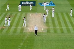 HAMILTON, NEW ZEALAND - DECEMBER 06: General view as Neil Wagner of New Zealand is congratulated by team mates after taking the final wicket during day four of the First Test match in the series between New Zealand and the West Indies at Seddon Park on December 06, 2020 in Hamilton, New Zealand. (Photo by Kai Schwoerer/Getty Images)