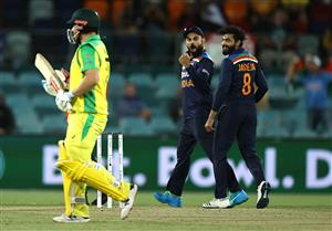 CANBERRA, AUSTRALIA - DECEMBER 02: Virat Kohli of India celebrates after Ravindra Jadeja of India took the wicket of Aaron Finch of Australia during game three of the One Day International series between Australia and India at Manuka Oval on December 02, 2020 in Canberra, Australia. (Photo by Ryan Pierse/Getty Images)