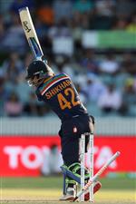 CANBERRA, AUSTRALIA - DECEMBER 04: Shikhar Dhawan of India is bowled by Mitchell Starc of Australia during game one of the Twenty20 International series between Australia and India at Manuka Oval on December 04, 2020 in Canberra, Australia. (Photo by Mark Kolbe/Getty Images)