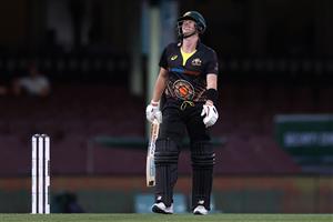 SYDNEY, AUSTRALIA - DECEMBER 06: Steve Smith of Australia reacts after being struck high on the thigh during game two of the Twenty20 International series between Australia and India at Sydney Cricket Ground on December 06, 2020 in Sydney, Australia. (Photo by Ryan Pierse/Getty Images)