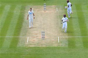 HAMILTON, NEW ZEALAND - DECEMBER 06: Tim Southee of New Zealand looks on as Jermaine Blackwood of the West Indies and Alzarri Joseph of the West Indies (L-R) make runs during day four of the First Test match in the series between New Zealand and the West Indies at Seddon Park on December 06, 2020 in Hamilton, New Zealand. (Photo by Kai Schwoerer/Getty Images)