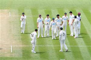 HAMILTON, NEW ZEALAND - DECEMBER 06: Captain Kane Williamson of New Zealand (L) and his team mates walk from the ground after New Zealand win by an innings and 134 runs after day four of the First Test match in the series between New Zealand and the West Indies at Seddon Park on December 06, 2020 in Hamilton, New Zealand. (Photo by Kai Schwoerer/Getty Images)