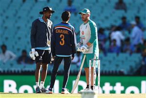 SYDNEY, AUSTRALIA - DECEMBER 08: Aaron Finch of Australia speaks to Hardik Pandya and Yuzvendra Chahal of India before game three of the Twenty20 International series between Australia and India at Sydney Cricket Ground on December 08, 2020 in Sydney, Australia. (Photo by Ryan Pierse/Getty Images)