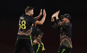 SYDNEY, AUSTRALIA - DECEMBER 08: Andrew Tye of Australia celebrates after taking the wicket of Virat Kohli of India during game three of the Twenty20 International series between Australia and India at Sydney Cricket Ground on December 08, 2020 in Sydney, Australia. (Photo by Ryan Pierse/Getty Images)