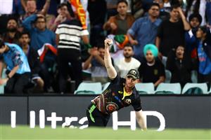 SYDNEY, AUSTRALIA - DECEMBER 08: Daniel Sams of Australia catches Shikhar Dhawan of India off a delivery by Mitchell Swepson of Australia during game three of the Twenty20 International series between Australia and India at Sydney Cricket Ground on December 08, 2020 in Sydney, Australia. (Photo by Cameron Spencer/Getty Images)