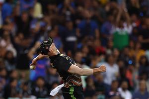 SYDNEY, AUSTRALIA - DECEMBER 08: Daniel Sams of Australia celebrates after taking a catch to dismiss Shikhar Dhawan of India off the bowling of Mitchell Swepson of Australia during game three of the Twenty20 International series between Australia and India at Sydney Cricket Ground on December 08, 2020 in Sydney, Australia. (Photo by Ryan Pierse/Getty Images)