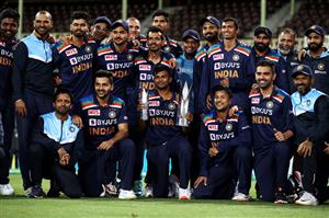 SYDNEY, AUSTRALIA - DECEMBER 08: India pose with the T20 trophy following game three of the Twenty20 International series between Australia and India at Sydney Cricket Ground on December 08, 2020 in Sydney, Australia. (Photo by Cameron Spencer/Getty Images)