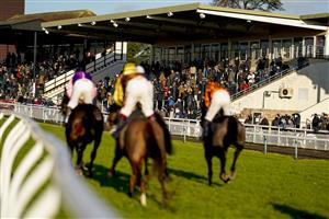 FONTWELL, ENGLAND - DECEMBER 08: A ggod crowd watch the action during The Change Your Life With mysense.com Handicap Chase at Fontwell Park Racecourse on December 08, 2020 in Fontwell, England. Owners and a limited number of the public are allowed to attend the meeting due to the Coronavirus pandemic. (Photo by Alan Crowhurst/Getty Images)