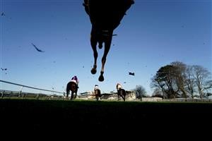 FONTWELL, ENGLAND - DECEMBER 08: A general view as runners clear a fence during The Change Your Life With mysense.com Handicap Chase at Fontwell Park Racecourse on December 08, 2020 in Fontwell, England. Owners and a limited number of the public are allowed to attend the meeting due to the Coronavirus pandemic. (Photo by Alan Crowhurst/Getty Images)