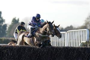 FONTWELL, ENGLAND - DECEMBER 08: Joshua Moore riding Bridle Loanan (blue/pink) on their way to winning The Thank You To The Cisswood Team Handicap Chase at Fontwell Park Racecourse on December 08, 2020 in Fontwell, England. Owners and a limited number of the public are allowed to attend the meeting due to the Coronavirus pandemic. (Photo by Alan Crowhurst/Getty Images)