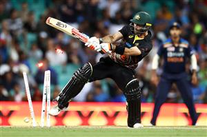 SYDNEY, AUSTRALIA - DECEMBER 08: Glenn Maxwell of Australia is dismissed by Thangarasu Natarajan of India during game three of the Twenty20 International series between Australia and India at Sydney Cricket Ground on December 08, 2020 in Sydney, Australia. (Photo by Cameron Spencer/Getty Images)