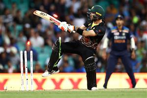 SYDNEY, AUSTRALIA - DECEMBER 08: Glenn Maxwell of Australia is dismissed by Thangarasu Natarajan of India during game three of the Twenty20 International series between Australia and India at Sydney Cricket Ground on December 08, 2020 in Sydney, Australia. (Photo by Cameron Spencer/Getty Images)