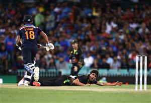 SYDNEY, AUSTRALIA - DECEMBER 08: Sean Abbott of Australia reacts after diving to field the ball during game three of the Twenty20 International series between Australia and India at Sydney Cricket Ground on December 08, 2020 in Sydney, Australia. (Photo by Ryan Pierse/Getty Images)
