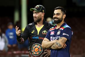 SYDNEY, AUSTRALIA - DECEMBER 08: Glenn Maxwell of Australia talks to Virat Kohli of India following game three of the Twenty20 International series between Australia and India at Sydney Cricket Ground on December 08, 2020 in Sydney, Australia. (Photo by Cameron Spencer/Getty Images)