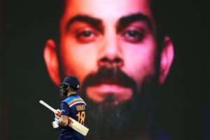 SYDNEY, AUSTRALIA - DECEMBER 08: Virat Kohli of India leaves the field after being dismissed by Andrew Tye of Australia during game three of the Twenty20 International series between Australia and India at Sydney Cricket Ground on December 08, 2020 in Sydney, Australia. (Photo by Cameron Spencer/Getty Images)