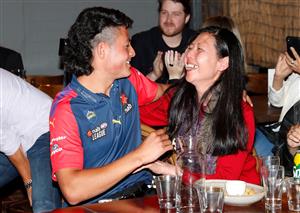 MELBOURNE, AUSTRALIA - DECEMBER 09: Connor Downie celebrates with family after his name is read out during the NAB AFL Draft on December 09, 2020 in Melbourne, Australia. (Photo by Michael Willson/AFL Photos via Getty Images)