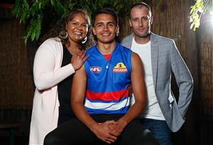 MELBOURNE, AUSTRALIA - DECEMBER 09: Jamarra Ugle-Hagan poses for a photograph with parents Alice and Aaron after being announced as the number 1 pick during the NAB AFL Draft on December 09, 2020 in Melbourne, Australia. (Photo by Michael Willson/AFL Photos via Getty Images)