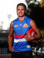 MELBOURNE, AUSTRALIA - DECEMBER 09: Jamarra Ugle-Hagan poses for a photograph in a Bulldogs jumper after being announced as the number 1 pick during the NAB AFL Draft on December 09, 2020 in Melbourne, Australia. (Photo by Michael Willson/AFL Photos via Getty Images)