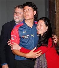 MELBOURNE, AUSTRALIA - DECEMBER 09: Connor Downie celebrates with his parents after his name is read out during the NAB AFL Draft on December 09, 2020 in Melbourne, Australia. (Photo by Michael Willson/AFL Photos via Getty Images)