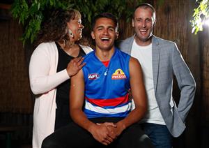 MELBOURNE, AUSTRALIA - DECEMBER 09: Jamarra Ugle-Hagan poses for a photograph with parents Alice and Aaron after being announced as the number 1 pick during the NAB AFL Draft on December 09, 2020 in Melbourne, Australia. (Photo by Michael Willson/AFL Photos via Getty Images)