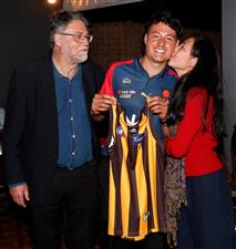 MELBOURNE, AUSTRALIA - DECEMBER 09: Connor Downie celebrates with his parents after his name is read out during the NAB AFL Draft on December 09, 2020 in Melbourne, Australia. (Photo by Michael Willson/AFL Photos via Getty Images)