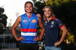 MELBOURNE, AUSTRALIA - DECEMBER 09: Jamarra Ugle-Hagan poses for a photograph in a Bulldogs jumper with Bailey Smith after being announced as the number 1 pick during the NAB AFL Draft on December 09, 2020 in Melbourne, Australia. (Photo by Michael Willson/AFL Photos via Getty Images)