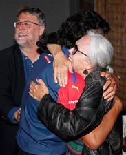 MELBOURNE, AUSTRALIA - DECEMBER 09: Connor Downie celebrates with family after his name is read out during the NAB AFL Draft on December 09, 2020 in Melbourne, Australia. (Photo by Michael Willson/AFL Photos via Getty Images)