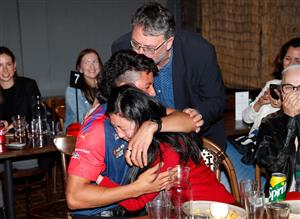 MELBOURNE, AUSTRALIA - DECEMBER 09: Connor Downie celebrates with family after his name is read out during the NAB AFL Draft on December 09, 2020 in Melbourne, Australia. (Photo by Michael Willson/AFL Photos via Getty Images)