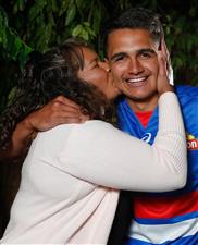 MELBOURNE, AUSTRALIA - DECEMBER 09: Jamarra Ugle-Hagan receives a kiss from mother Alice after being announced as the number 1 pick during the NAB AFL Draft on December 09, 2020 in Melbourne, Australia. (Photo by Michael Willson/AFL Photos via Getty Images)