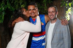 MELBOURNE, AUSTRALIA - DECEMBER 09: Jamarra Ugle-Hagan poses for a photograph with parents Alice and Aaron after being announced as the number 1 pick during the NAB AFL Draft on December 09, 2020 in Melbourne, Australia. (Photo by Michael Willson/AFL Photos via Getty Images)
