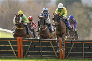 TAUNTON, ENGLAND - DECEMBER 10: Fergus Gillard riding Paricolor (R, white cap) on their way to winning The Kings College Taunton Selling Hurdle at Taunton Racecourse on December 10, 2020 in Taunton, England. Owners and a limited number of the public are allowed to attend the meeting due to the Coronavirus pandemic. (Photo by Alan Crowhurst/Getty Images)
