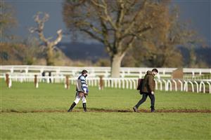 TAUNTON, ENGLAND - DECEMBER 10: A jockey and trainer make their way towards the stables at Taunton Racecourse on December 10, 2020 in Taunton, England. Owners and a limited number of the public are allowed to attend the meeting due to the Coronavirus pandemic. (Photo by Alan Crowhurst/Getty Images)