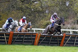 TAUNTON, ENGLAND - DECEMBER 10: Nathan Brennan riding Mount Windsor clear the last to win The Dave Criddle Travel - Let's Fly Again Handicap Hurdle at Taunton Racecourse on December 10, 2020 in Taunton, England. Owners and a limited number of the public are allowed to attend the meeting due to the Coronavirus pandemic. (Photo by Alan Crowhurst/Getty Images)