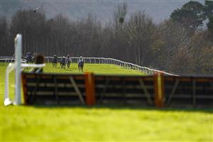 TAUNTON, ENGLAND - DECEMBER 10: Harry Cobden riding Atholl Street (R) turn into the straight to win The Racing To School Novices' Hurdle (GBB Race) (Div 1) at Taunton Racecourse on December 10, 2020 in Taunton, England. Owners and a limited number of the public are allowed to attend the meeting due to the Coronavirus pandemic. (Photo by Alan Crowhurst/Getty Images)