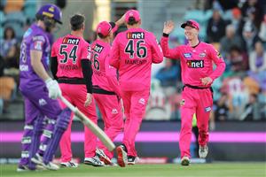 HOBART, AUSTRALIA - DECEMBER 10: Jordan Silk of the Sixers celebrates with team mates after taking a catch to dismiss Macalister Wright of the Hurricanes during the Big Bash League match between the Hobart Hurricanes and Sydney Sixers at Blundstone Arena, on December 10, 2020, in Hobart, Australia. (Photo by Matt King/Getty Images)