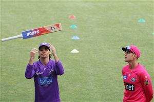 HOBART, AUSTRALIA - DECEMBER 10: Captains Peter Handscomb of the Hurricanes and Daniel Hughes of the Sixers take part in the bat flip during the Big Bash League match between the Hobart Hurricanes and Sydney Sixers at Blundstone Arena, on December 10, 2020, in Hobart, Australia. (Photo by Matt King/Getty Images)