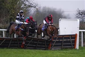 TAUNTON, ENGLAND - DECEMBER 10: Kevin Brogan riding How's The Cricket (R) clear the last to win The Dave Criddle Travel - Let's Cruise Again Handicap Hurdle at Taunton Racecourse on December 10, 2020 in Taunton, England. Owners and a limited number of the public are allowed to attend the meeting due to the Coronavirus pandemic. (Photo by Alan Crowhurst/Getty Images)