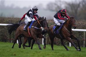 TAUNTON, ENGLAND - DECEMBER 10: Kevin Brogan riding How's The Cricket (R) clear the last to win The Dave Criddle Travel - Let's Cruise Again Handicap Hurdle at Taunton Racecourse on December 10, 2020 in Taunton, England. Owners and a limited number of the public are allowed to attend the meeting due to the Coronavirus pandemic. (Photo by Alan Crowhurst/Getty Images)