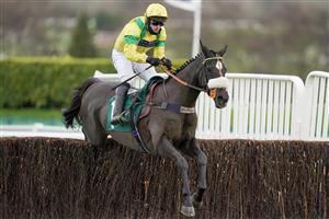 CHELTENHAM, ENGLAND - DECEMBER 11: David Bass riding Happygolucky clear the last to win The International Decorative Surfaces Novices' Chase at Cheltenham Racecourse on December 11, 2020 in Cheltenham, England. Owners and a limited number of the public are allowed to attend the meeting due to the Coronavirus pandemic. (Photo by Alan Crowhurst/Getty Images)