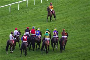 CHELTENHAM, ENGLAND - DECEMBER 11: A general view as runners circle at the start for the Citipost Handicap Hurdle at Cheltenham Racecourse on December 11, 2020 in Cheltenham, England. Owners and a limited number of the public are allowed to attend the meeting due to the Coronavirus pandemic. (Photo by Alan Crowhurst/Getty Images)