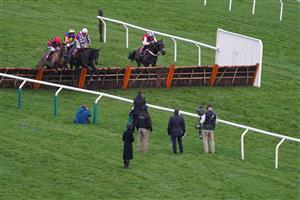 CHELTENHAM, ENGLAND - DECEMBER 11: Sam Twiston-Davies riding Come On Teddy (3L, white cap) clear the last to win The Citipost Handicap Hurdle at Cheltenham Racecourse on December 11, 2020 in Cheltenham, England. Owners and a limited number of the public are allowed to attend the meeting due to the Coronavirus pandemic. (Photo by Alan Crowhurst/Getty Images)
