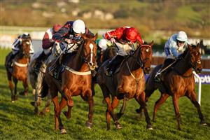 CHELTENHAM, ENGLAND - DECEMBER 12: Aidan Coleman riding Song For Someone (L, white cap) win The Unibet International Hurdle at Cheltenham Racecourse on December 12, 2020 in Cheltenham, England. Owners and a limited number of the public are allowed to attend the meeting due to the Coronavirus pandemic. (Photo by Alan Crowhurst/Getty Images)