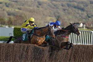 CHELTENHAM, ENGLAND - DECEMBER 12: Tom Scudamore riding Sky Pirate (yellow) clear the last to win The Spreadex Handicap Chase from Ibleo and Charlie Deutsch (R) at Cheltenham Racecourse on December 12, 2020 in Cheltenham, England. Owners and a limited number of the public are allowed to attend the meeting due to the Coronavirus pandemic. (Photo by Alan Crowhurst/Getty Images)