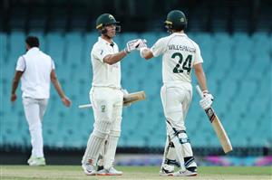 SYDNEY, AUSTRALIA - DECEMBER 13: Jack Wildermuth of Australia A celebrates scoring his half century with team mate Ben McDermott during day three of the Tour Match between Australia A and India at Sydney Cricket Ground on December 13, 2020 in Sydney, Australia. (Photo by Brendon Thorne/Getty Images)