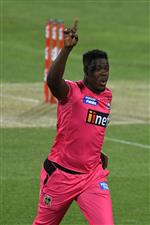 HOBART, AUSTRALIA - DECEMBER 13: Carlos Brathwaite of the Sixers celebrates taking the wicket of Jake Fraser-McGurk of the Renegades during the Big Bash League match between the Sydney Sixers and the Melbourne Renegades at Blundstone Arena, on December 13, 2020, in Hobart, Australia. (Photo by Steve Bell/Getty Images)