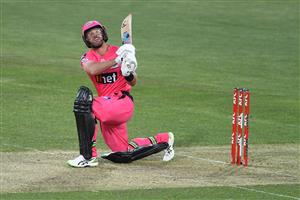 HOBART, AUSTRALIA - DECEMBER 13: Dan Christian of the Sixers puts the ball over for six during the Big Bash League match between the Sydney Sixers and the Melbourne Renegades at Blundstone Arena, on December 13, 2020, in Hobart, Australia. (Photo by Steve Bell/Getty Images)