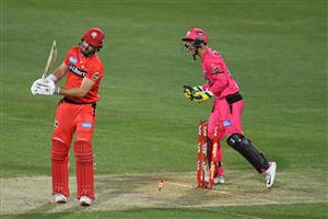 HOBART, AUSTRALIA - DECEMBER 13: Josh Philippe of the Sixers celebrates the wicket of Shaun Marsh of the Renegadesduring the Big Bash League match between the Sydney Sixers and the Melbourne Renegades at Blundstone Arena, on December 13, 2020, in Hobart, Australia. (Photo by Steve Bell/Getty Images)