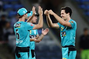 CANBERRA, AUSTRALIA - DECEMBER 14: Jack Wildermuth of the Heat celebrates with team mates after claiming the wicket of Callum Ferguson of the Thunder during the Big Bash League match between the Sydney Thunder and the Brisbane Heat at Manuka Oval, on December 14, 2020, in Canberra, Australia. (Photo by Brendon Thorne/Getty Images)